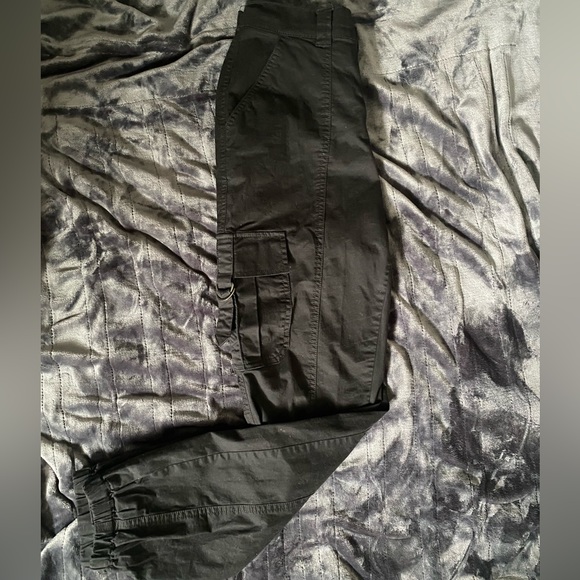 Black garage cargo pants with pockets and zipper double closed. Tighter cuffs. - Picture 2 of 6